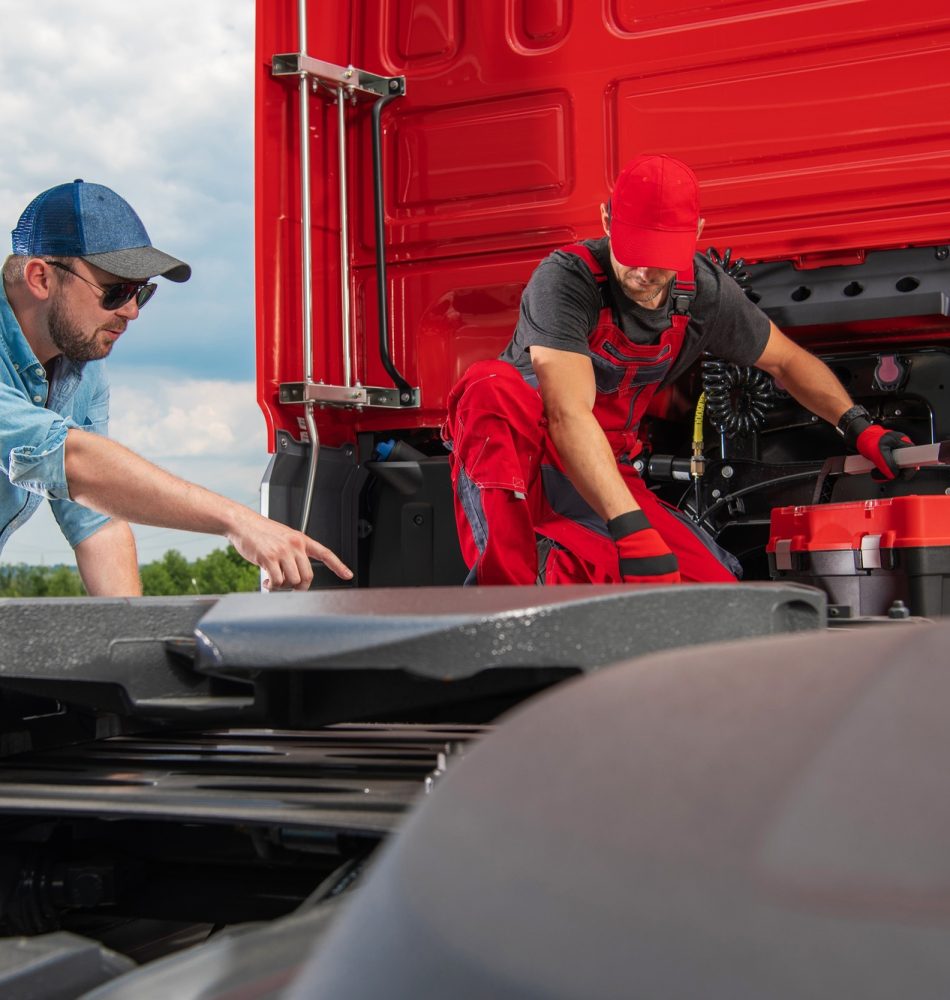 Trucker Showing Mechanic a Problem with His Truck